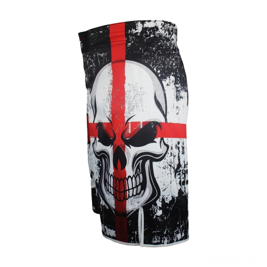 Vertical flat lay of black gothic training shorts displaying large prominent red skull cross print with worn texture details
