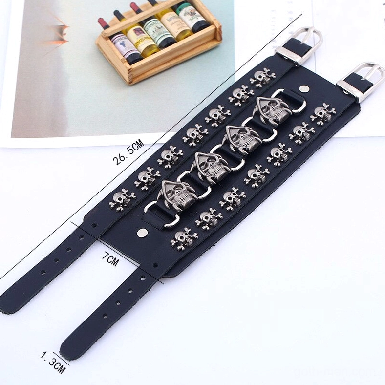 Flat lay punk skull leather bracelet with measurement labels showing size dimensions and adjustable strap design