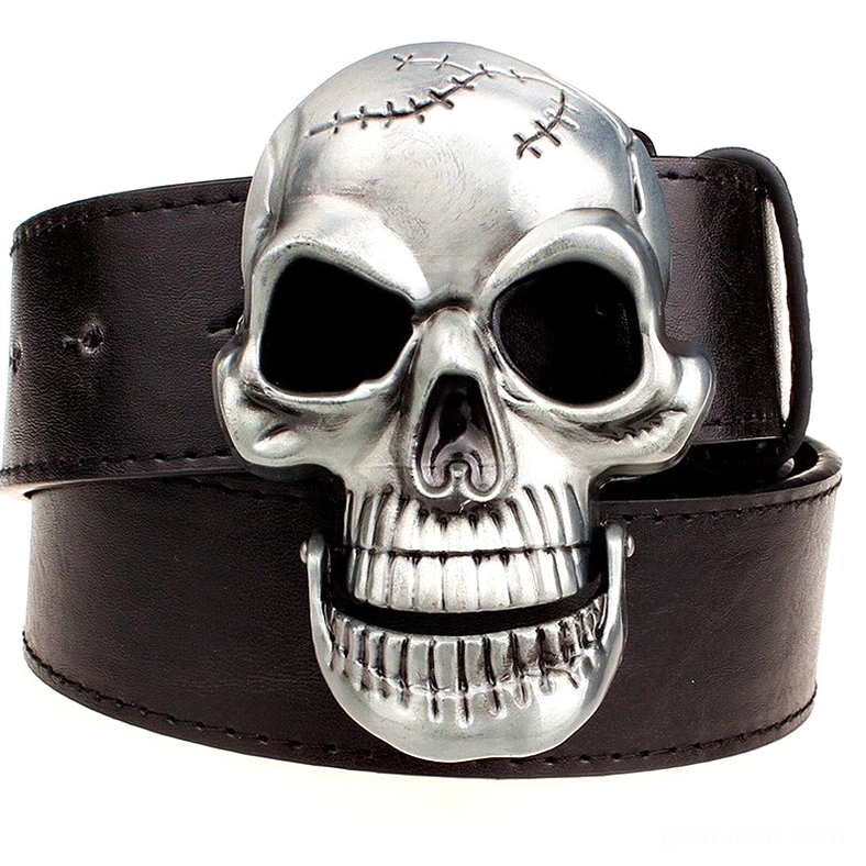 Statement skull metal buckle on black leather gothic belt, top-down view showing intricate stitched skull design