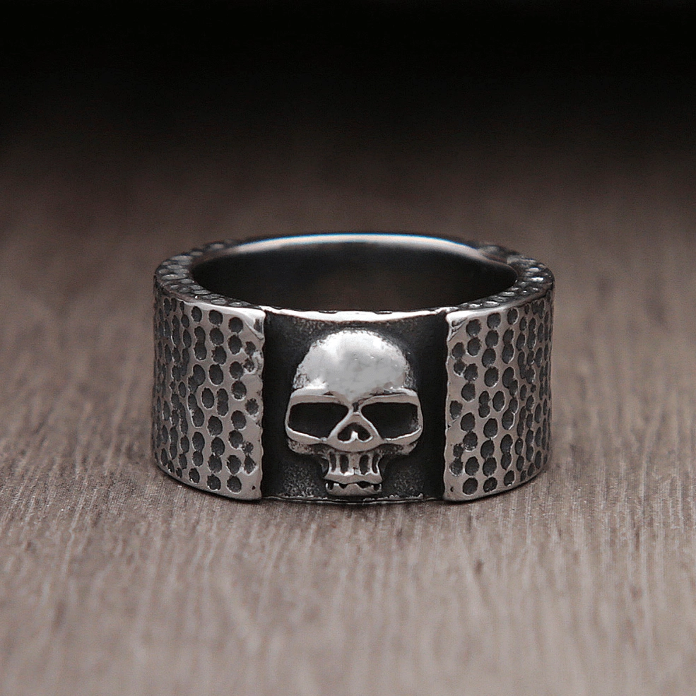 Frontal skull biker ring front view showcasing vintage dark silver finish and bold embossed design