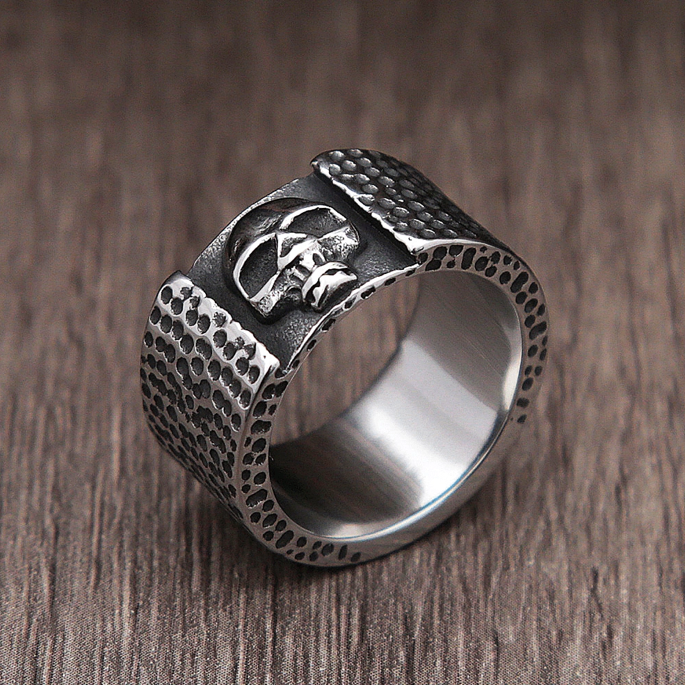 Cross-eyed skull biker ring 3/4 side view displaying embossed metalwork and texture