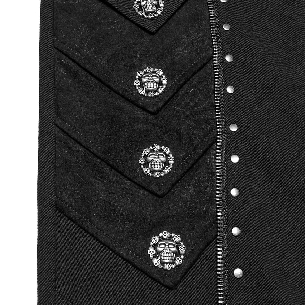 Embossed skull rivet details and silver metal studs on matte black gothic textile close-up