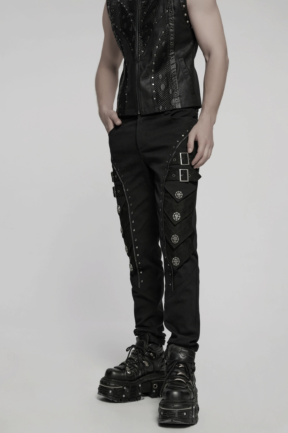 Skull rivet gothic pants textile close-up showing micro-elastic twill and embossed details