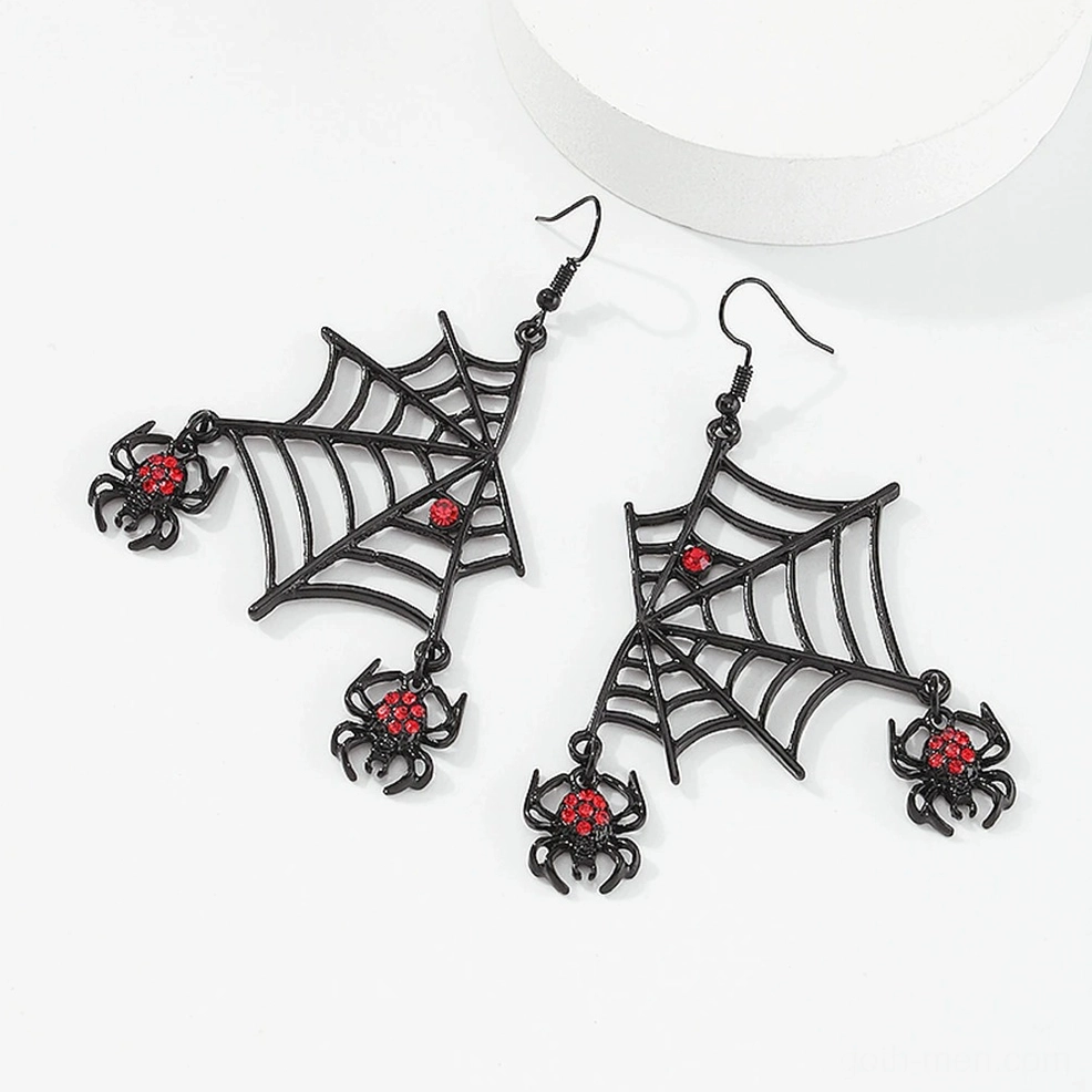 Gothic spider earrings flat lay overhead view, red rhinestone spider charms with fishhook ear wires on white background