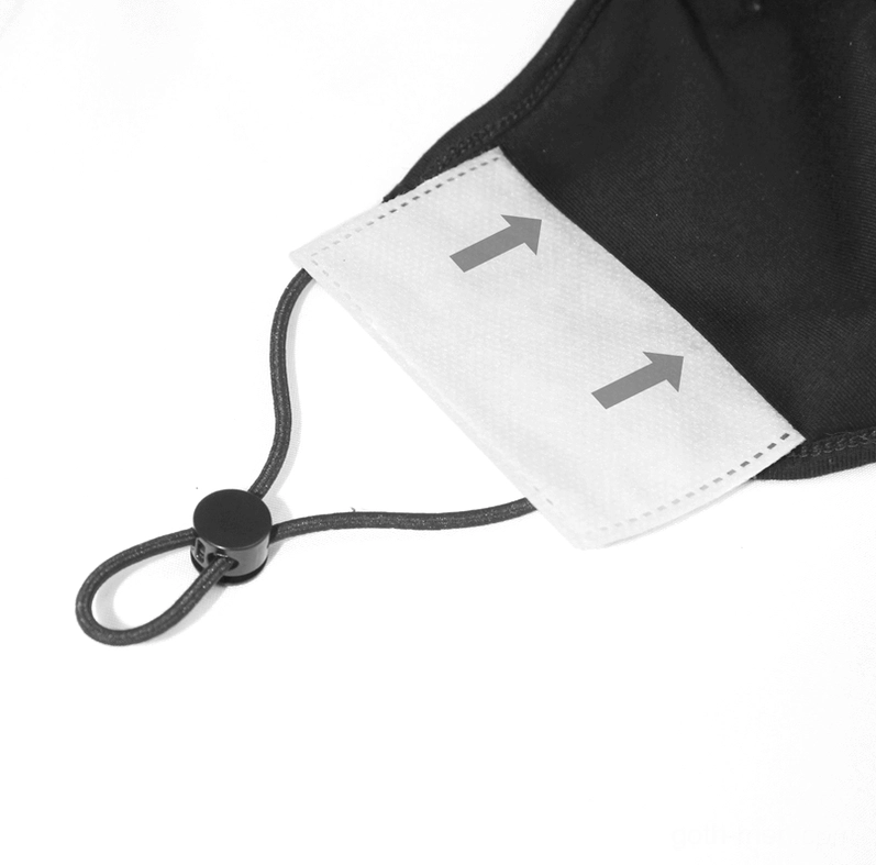 Close-up detail of black spiderweb gothic mask inner filter pocket and plastic cord lock adjuster