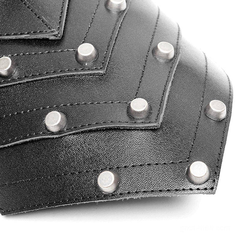 Close-up detail of spiked shoulder harness showing black leather with silver round rivets and stitched seams
