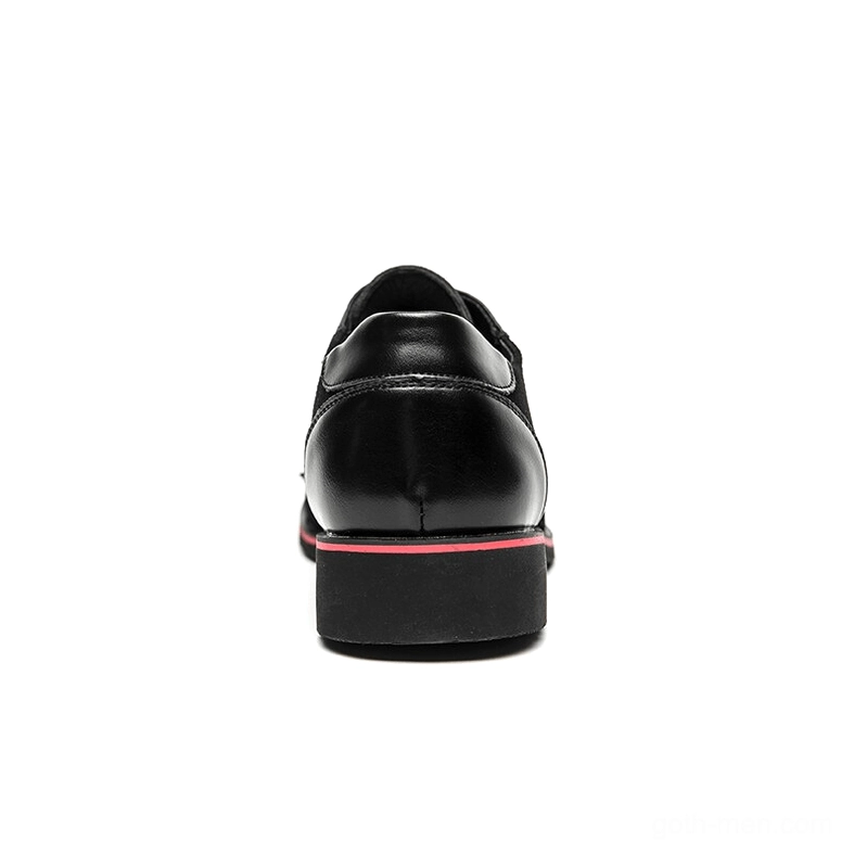 Rear view of black gothic spiked derby shoe showing shiny leather heel construction