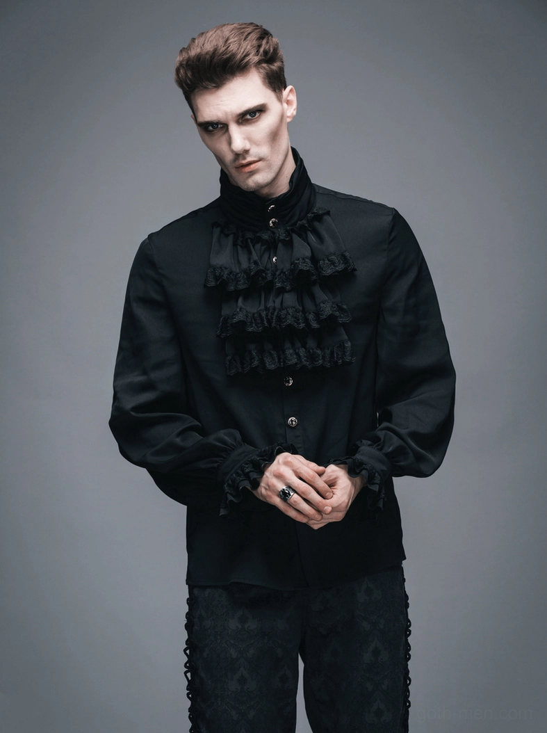 Men's steampunk ruffled shirt on model featuring black polyester fabric and ornate cuff buttons for alternative fashion styling