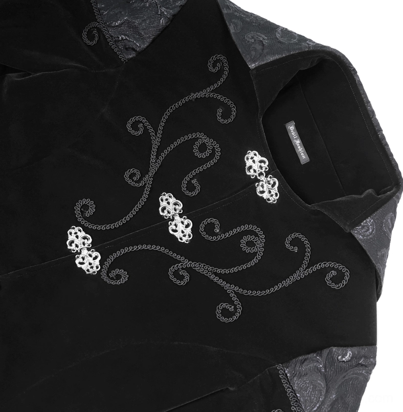 Steampunk coat collar and front panel close-up showing embroidered scroll patterns and metal clasp button detail