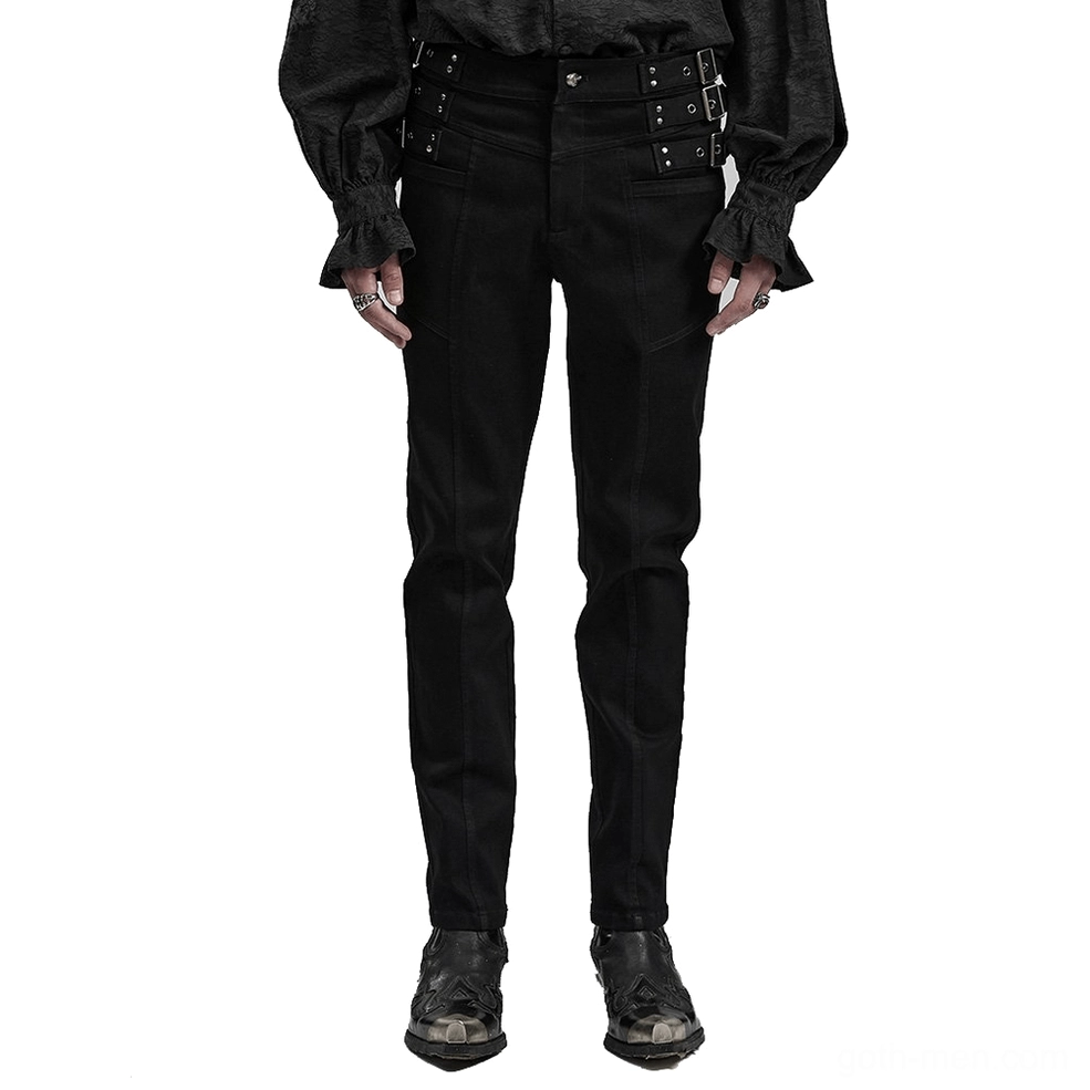 Black studded slim-fit gothic denim pants front view on male model, silver metal waist hardware detail