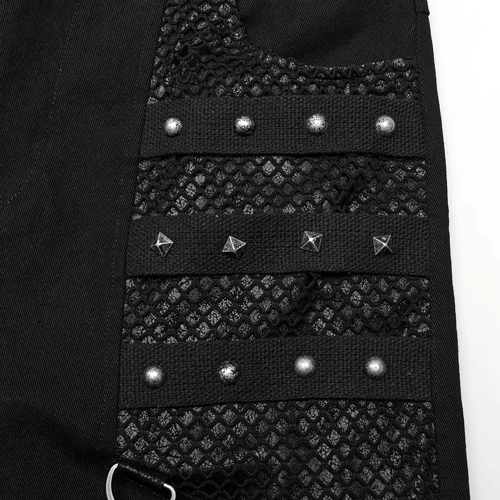Close-up detail of studded webbing, pyramid rivets, and quilted mesh fabric construction