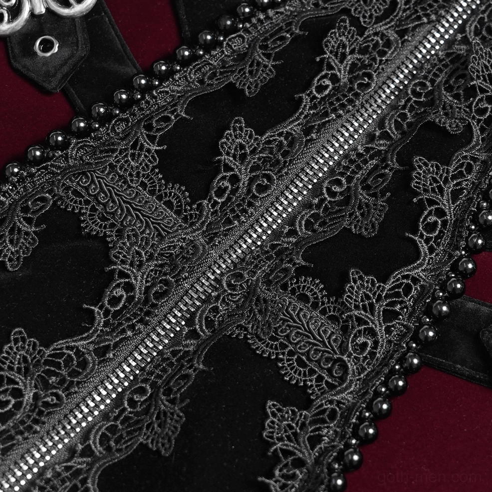 Macro close-up of black lace embroidery and beaded edge detailing on gothic velvet tailcoat fabric