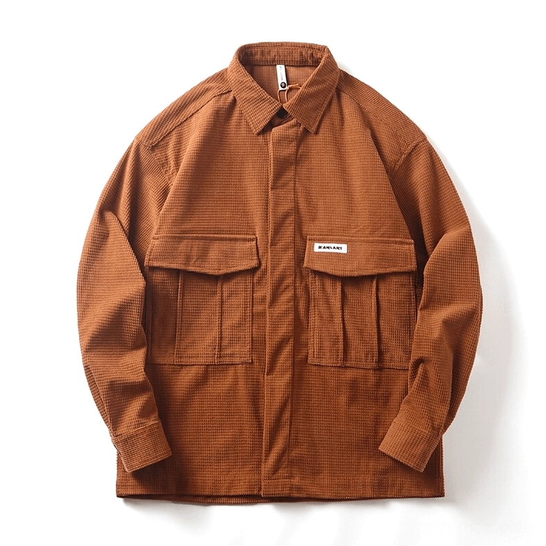 Tan waffle cord oversized gothic cargo shirt flat lay view with brand patch pocket visible, showing relaxed fit silhouette characteristic of alternative fashion