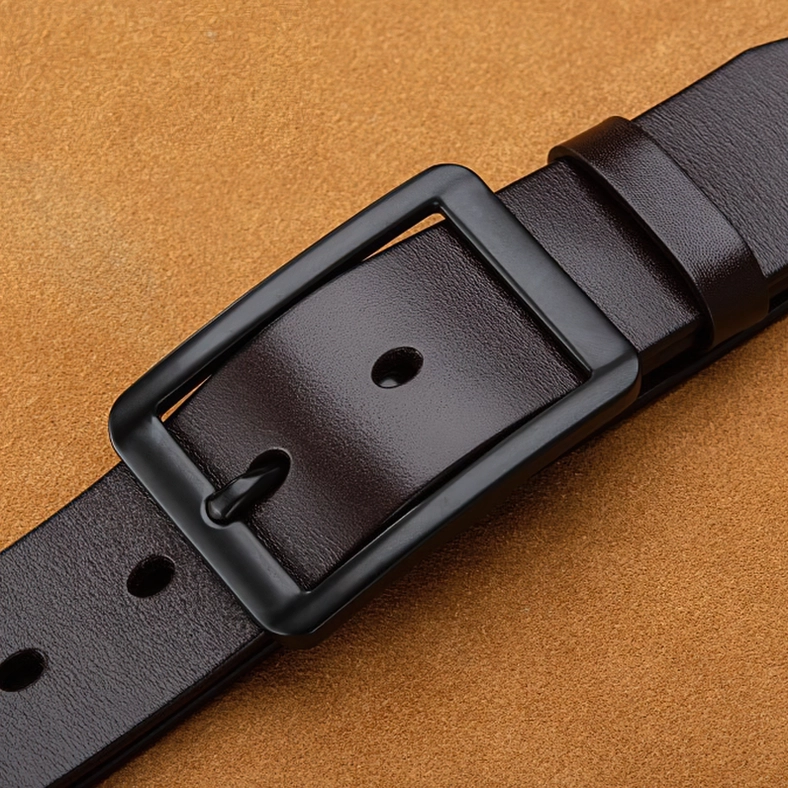 Tan genuine leather gothic belt with black pin buckle closeup, showing quality craftsmanship and adjustable fit