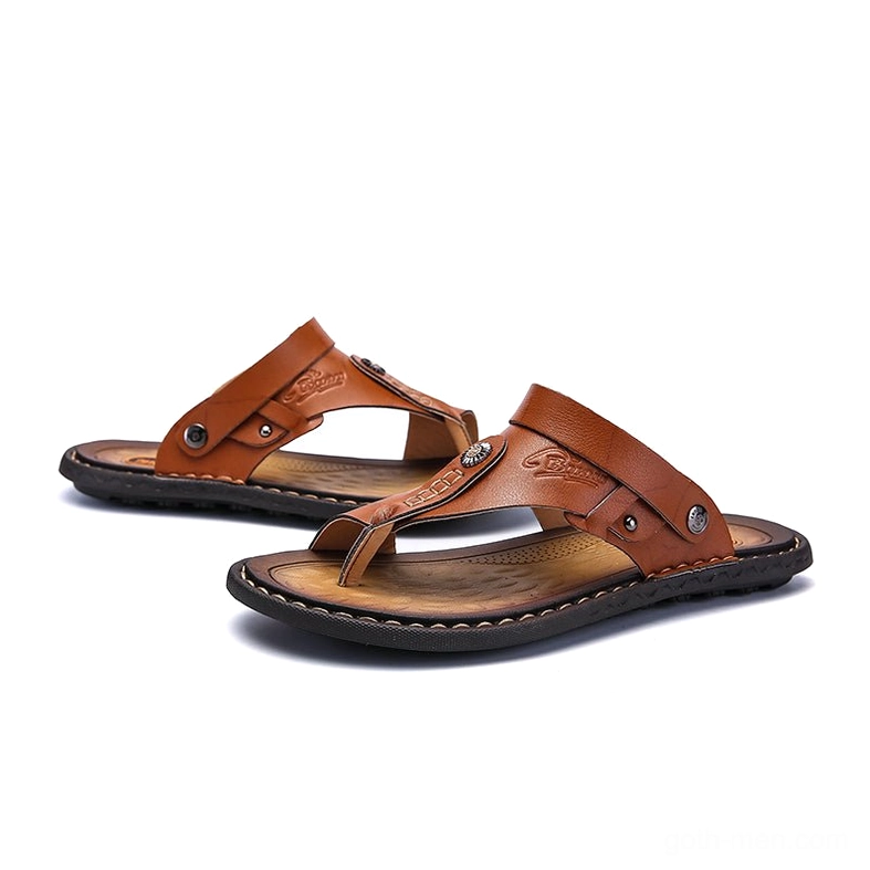 Tan gothic sandals front view showing embossed detailing and brown PU outsole