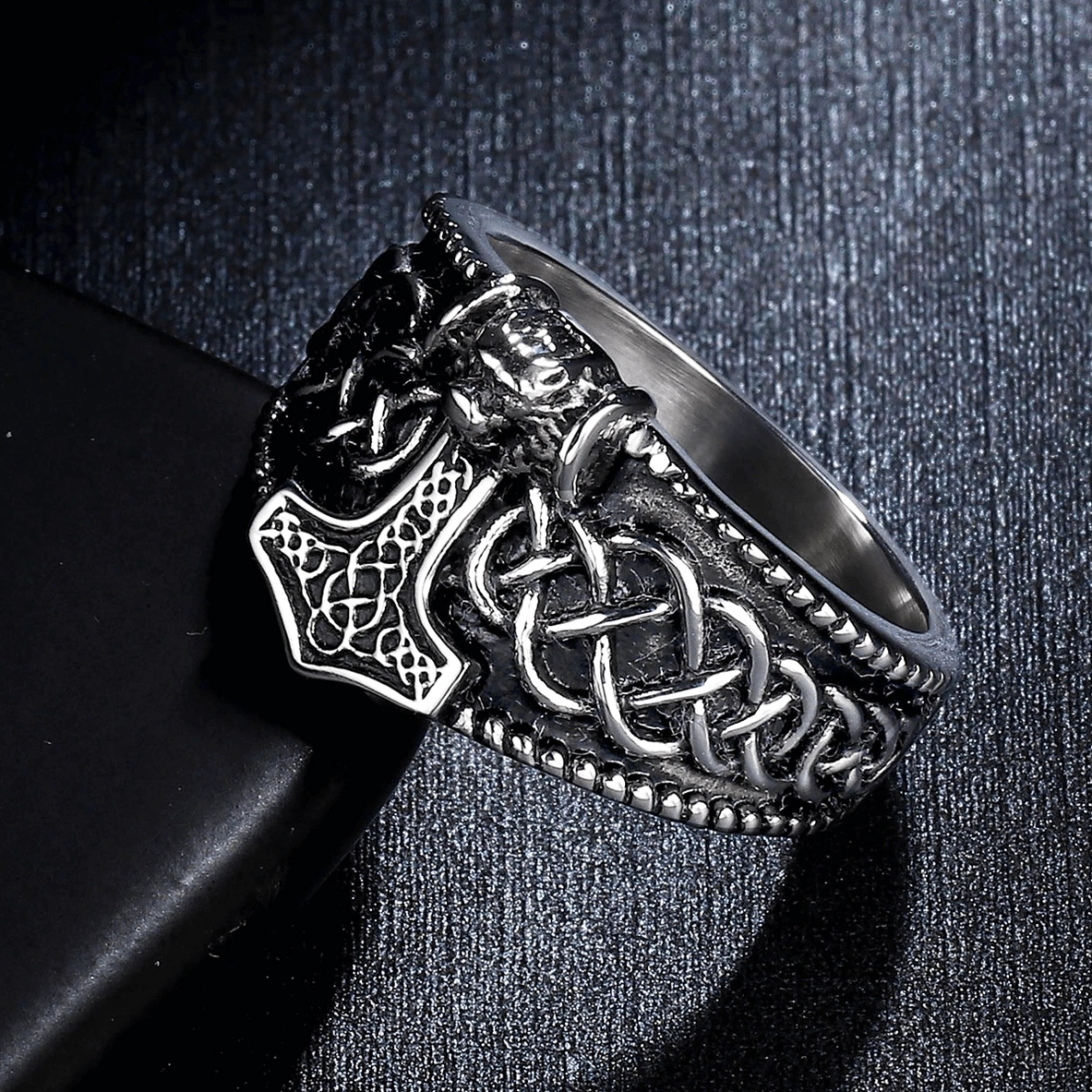 Vintage silver-black gothic men's ring side angle showing Mjolnir, skull, and Celtic knot engravings