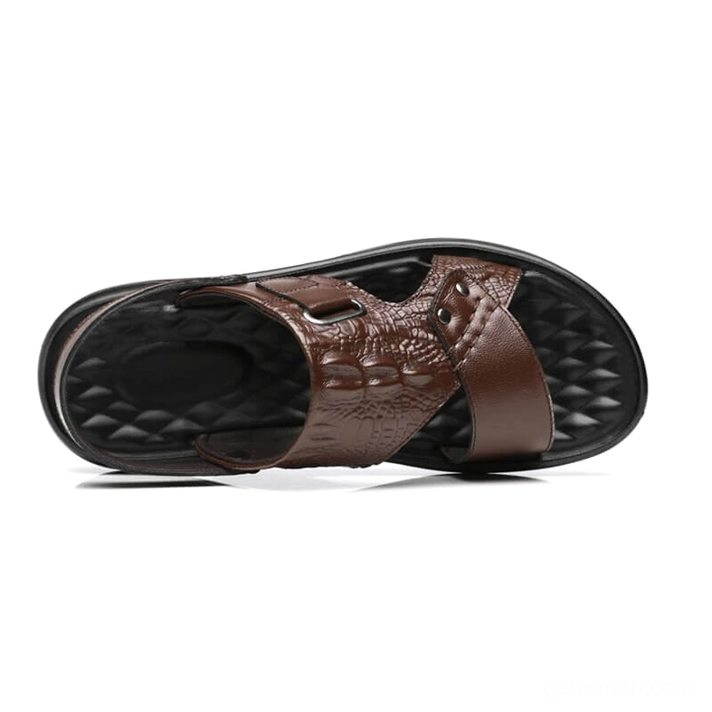 Two-tone brown and black embossed leather sandals overhead view displaying quilted insole and strap details