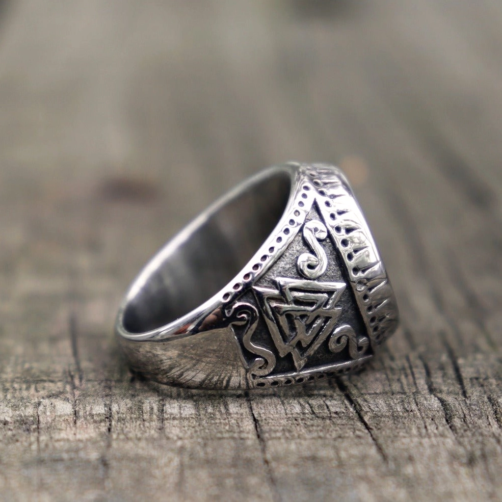 Norse valknut amulet ring side profile view showing polished silver surface with engraved side pattern details