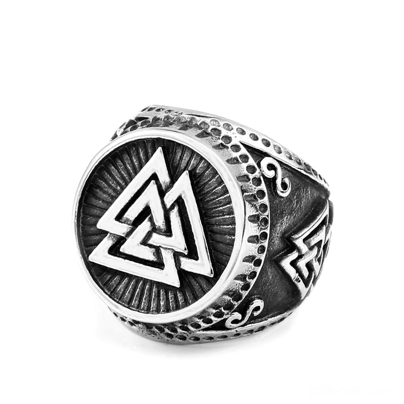 Viking valknut ring three-quarter front view with white filled interlocking triangles and ornate engraved scrollwork band