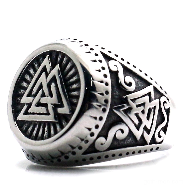 Valknut signet ring three-quarter view showing engraved Norse knot symbol and ornate scrollwork band in polished stainless steel