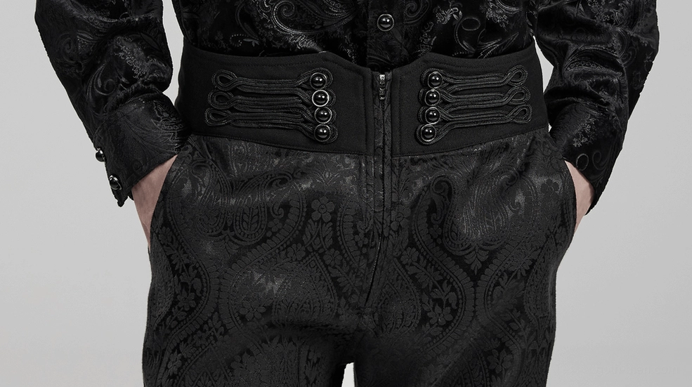 Close-up of gothic men's trousers waistband showing frog button closures and jacquard fabric