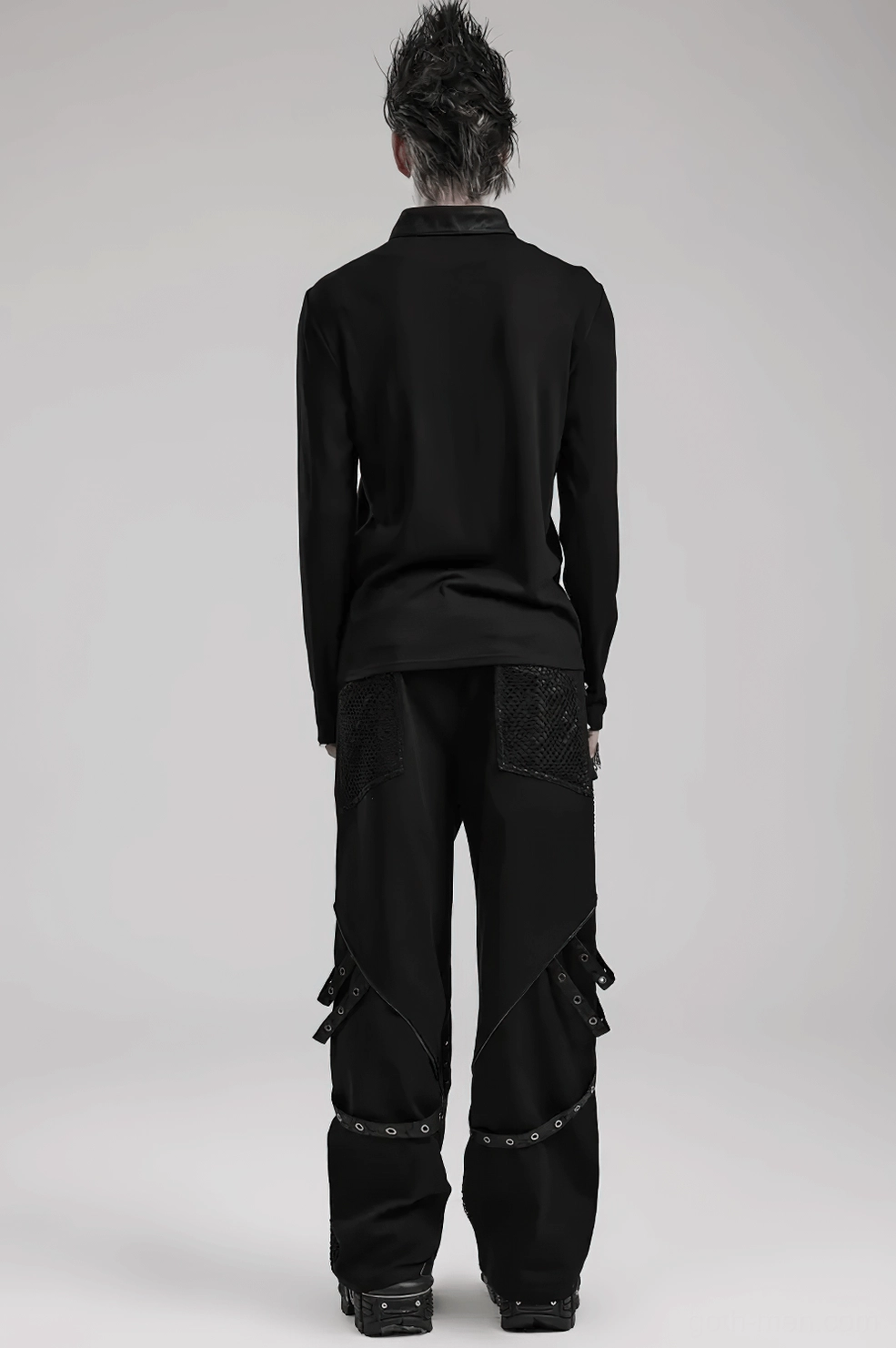 Waistband and upper leg studded accents showing rivet patterns and webbing construction