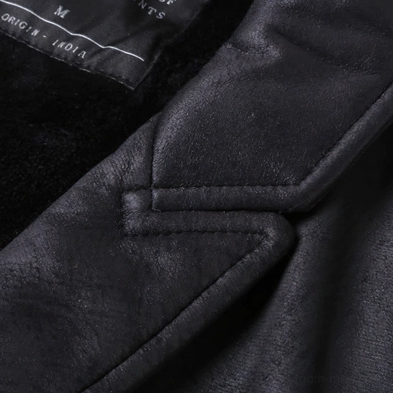 Black gothic waistcoat interior close-up showing size label and fleece lining