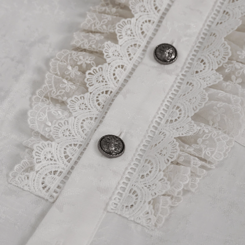 Detailed view of white gothic shirt front placket featuring scalloped lace ruffle, vintage metal button spacing, and precision stitching on dark surface