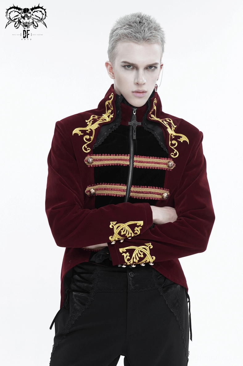 Gothic wine red tailcoat on model with crossed arms showing gold cuff embroidery and zipper closure